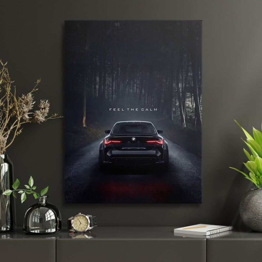 Motivational wall art with a night BMW on a forest road and the text “Feel the Calm” in a work zone