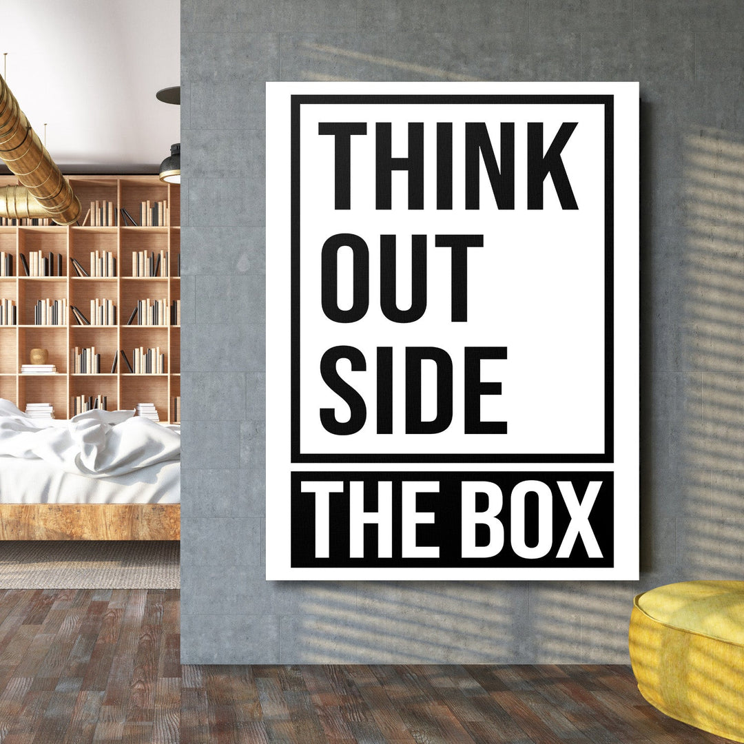 Black and white “Think Outside the Box” motivational canvas wall art above a bed in a modern bedroom