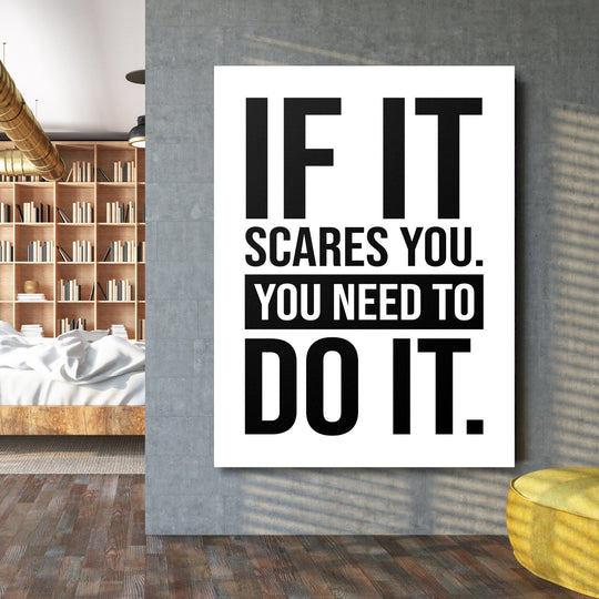 Motivational wall art with the quote “If it scares you, you need to do it” in an industrial interior