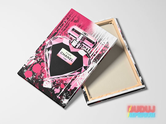 Motivational canvas wall art with a pink and black pop art graffiti heart-shaped perfume bottle, front view.