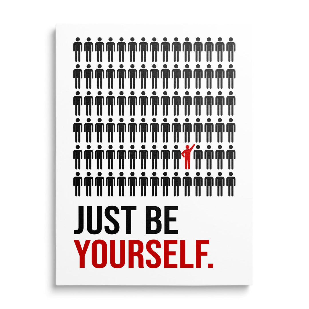 Front view of motivational canvas wall art with a “Just Be Yourself” quote and a red icon among black figures