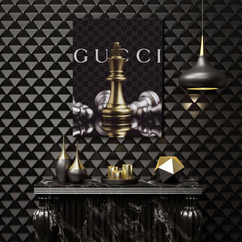 Luxury canvas wall art with a golden chess queen and defeated pieces in a black and gold interior.