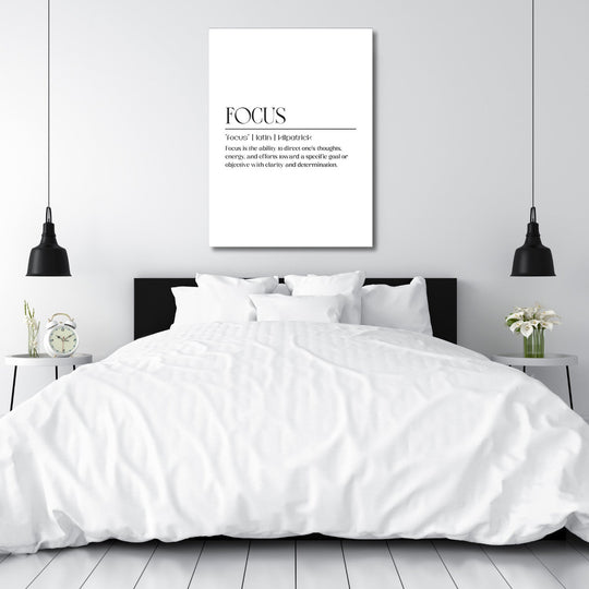 Bedroom with a black headboard and FOCUS motivational canvas wall art, styled with table lamps and flowers
