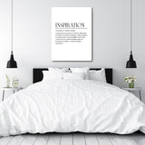 Framed motivational wall art with a minimalist quote above a double bed in a modern bedroom