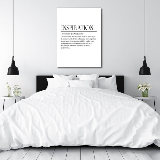Framed motivational wall art with a minimalist quote above a double bed in a modern bedroom