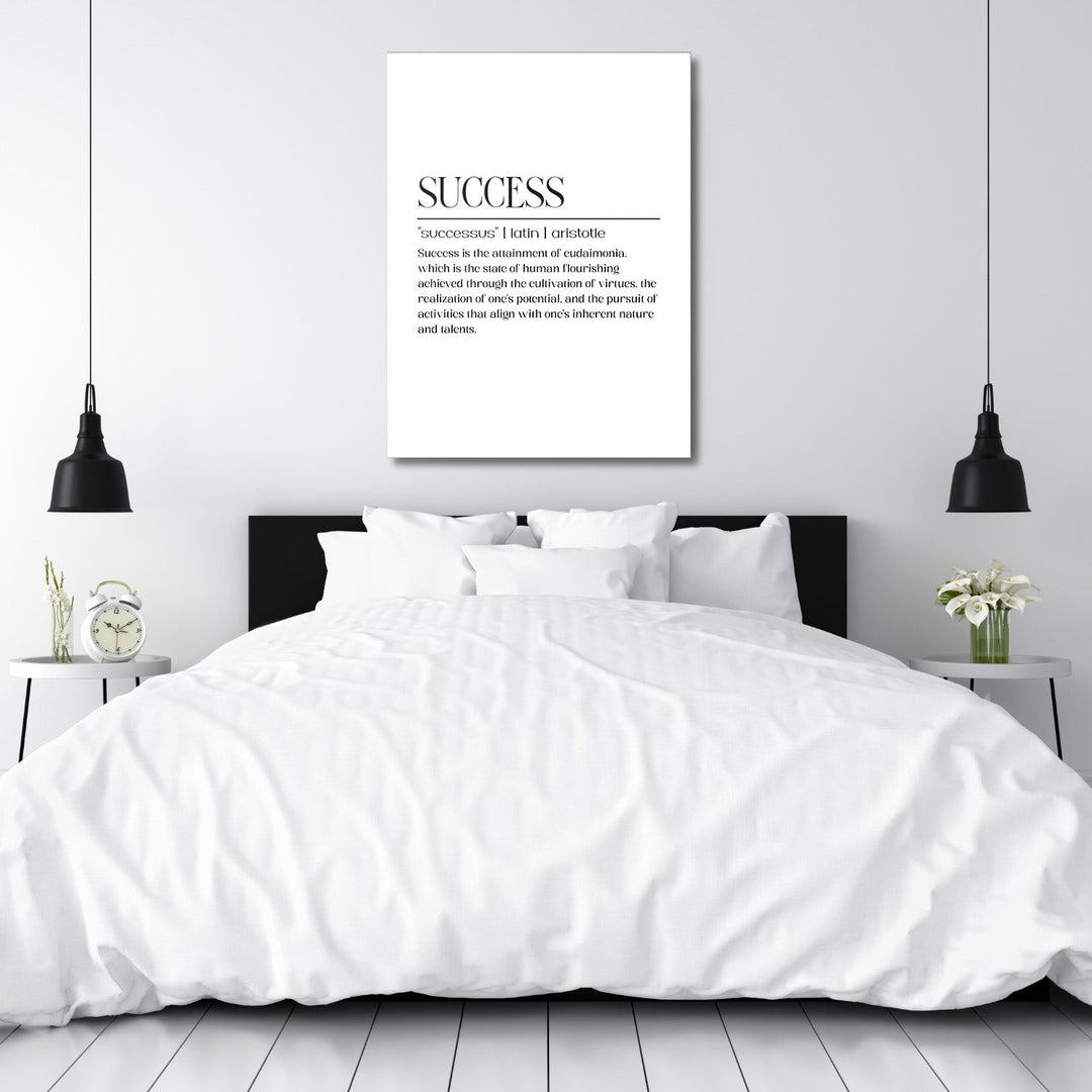 Motivational canvas print above a bed with a minimalist black-and-white SUCCESS quote in a modern bedroom