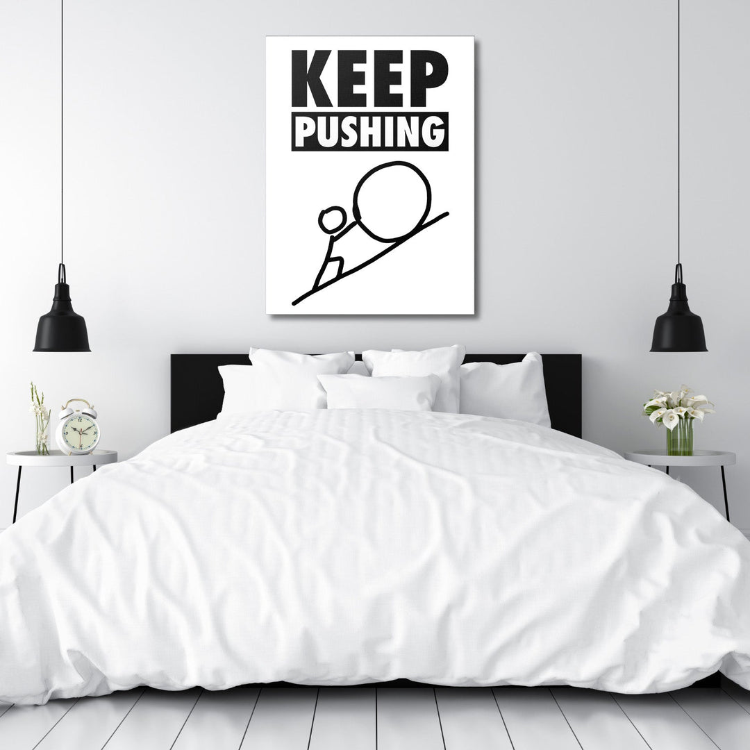 KEEP PUSHING minimalist motivational wall art above a bed in a white bedroom