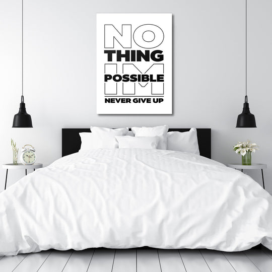 Black and white “NO THING IM POSSIBLE NEVER GIVE UP” motivational canvas wall art hanging above a bedroom bed