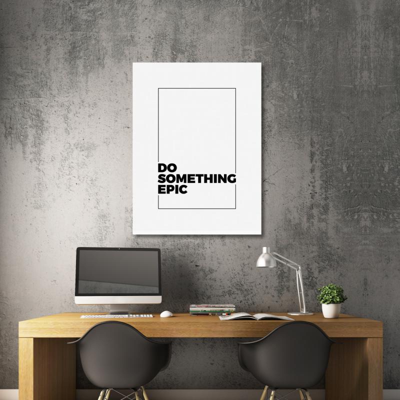 Motivational canvas wall art with the “DO SOMETHING EPIC” quote above a wooden desk in a modern office.