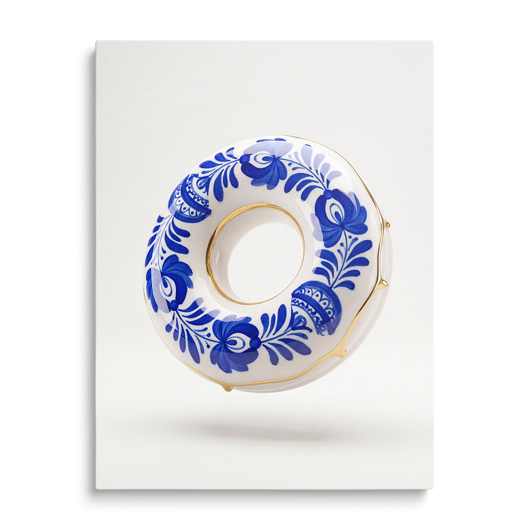 Modern canvas print, close-up of a porcelain donut in blue-and-white floral decor with gold detailing