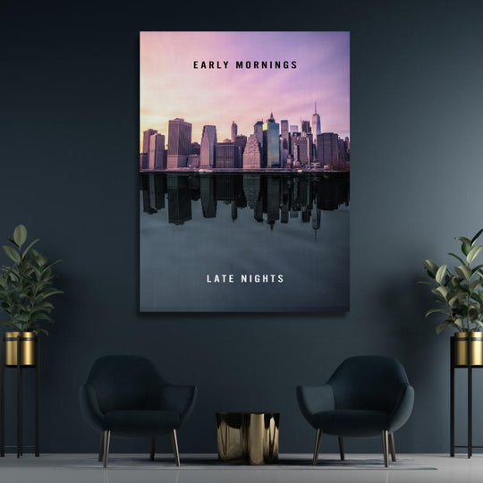 Motivational canvas wall art with a night city skyline and water reflection in a modern office.