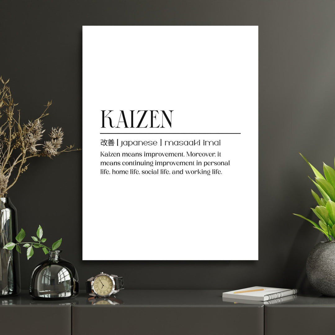 KAIZEN motivational canvas wall art with Japanese characters in a modern minimalist study with green plants