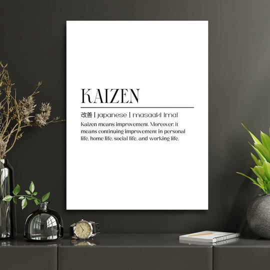 KAIZEN motivational canvas wall art with Japanese characters in a modern minimalist study with green plants