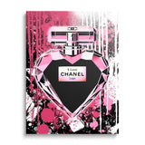 Pop art wall art with a pink heart-shaped perfume bottle and a motivational graffiti motif on the wall.