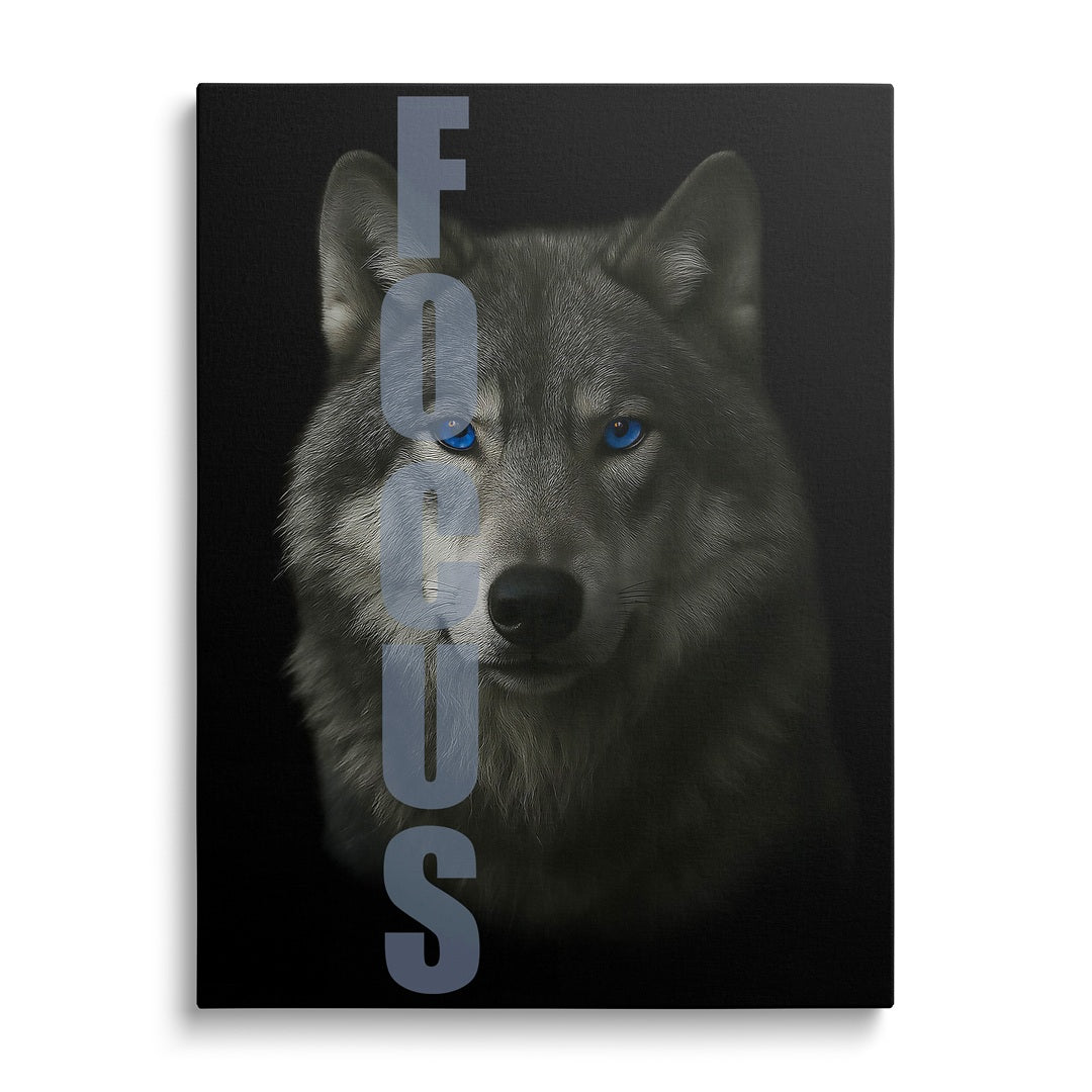 Motivational canvas wall art with a wolf portrait, blue eyes and vertical FOCUS text, front view.