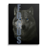 Motivational canvas wall art with a wolf portrait, blue eyes and vertical FOCUS text, front view.