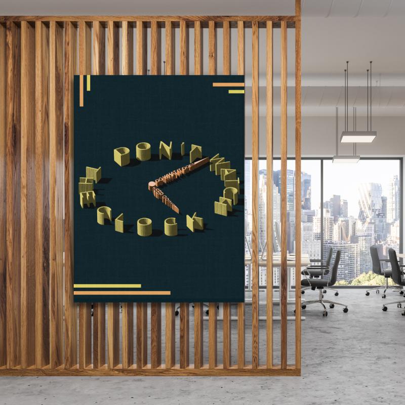 Motivational wall art with a 3D clock-shaped quote in a minimalist modern office.