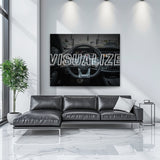 Motivational canvas wall art with a luxury car interior and VISUALIZE text in a modern living room.